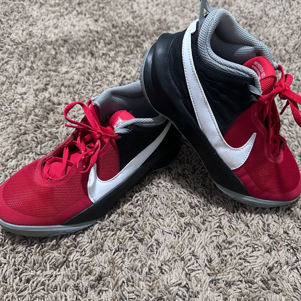 Youth Nike shoes. Red and black